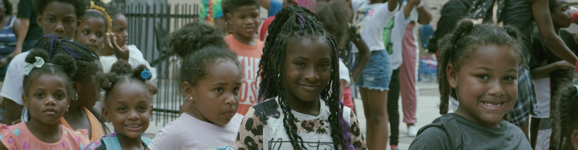 Diverse group of happy children standing in a line at a Launch of Philadelphia out-of-school-time program